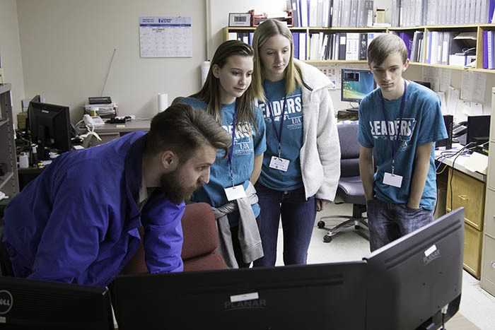 Students viewing monitor.