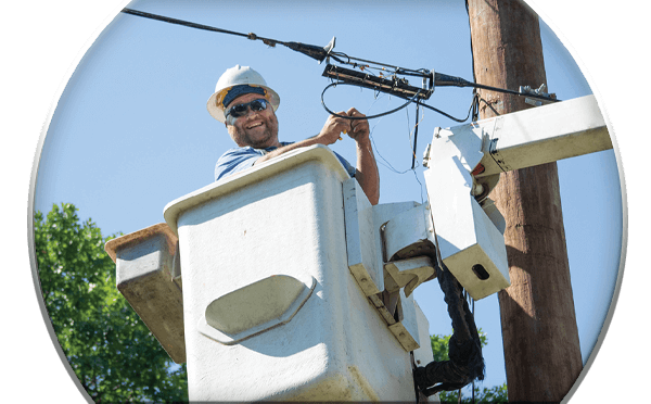 Man in bucket truck working on cable line