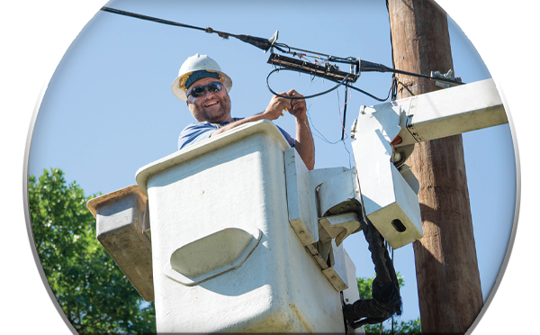 NATCO emplyoee working on a telephone live