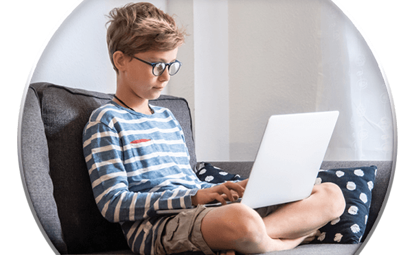 Young boy looking at laptop