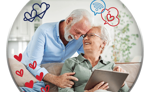 Elderly couple looking at tablet together