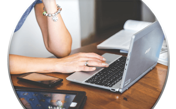 Woman using laptop at a desk