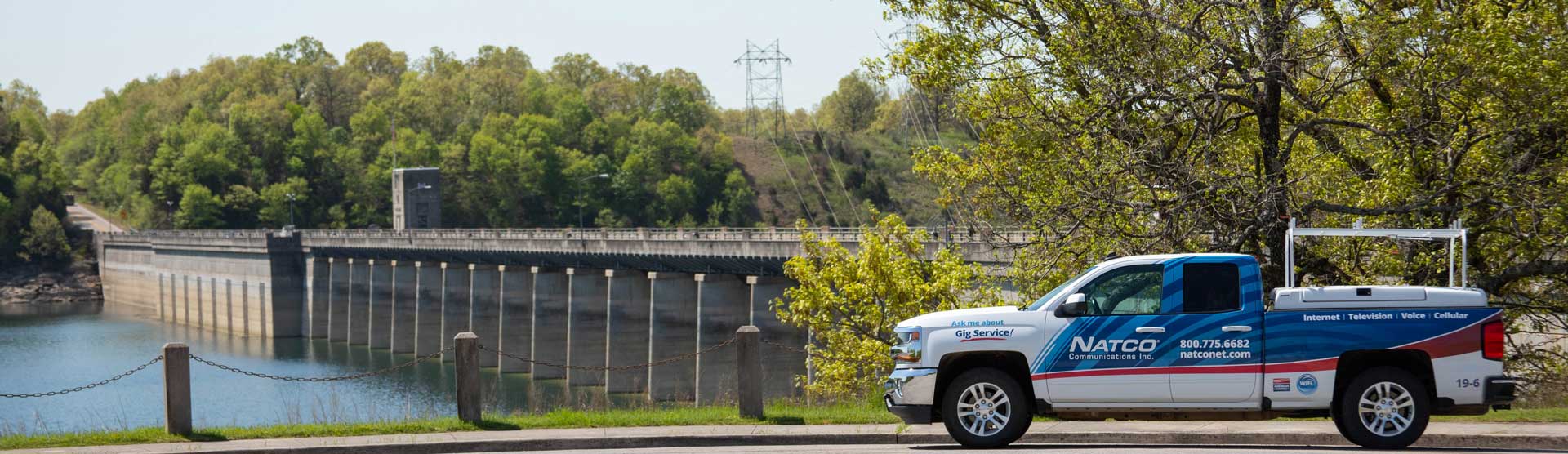 NATCO Truck park in front or Bull Shoals Dam