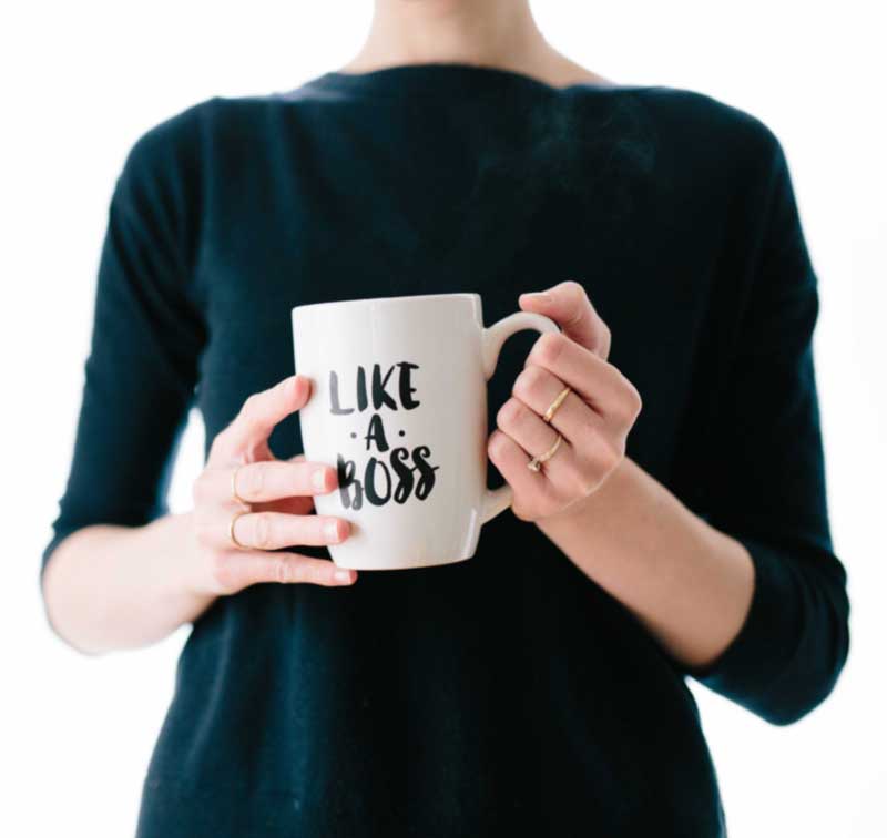 Woman holding mug with Like A Boss text
